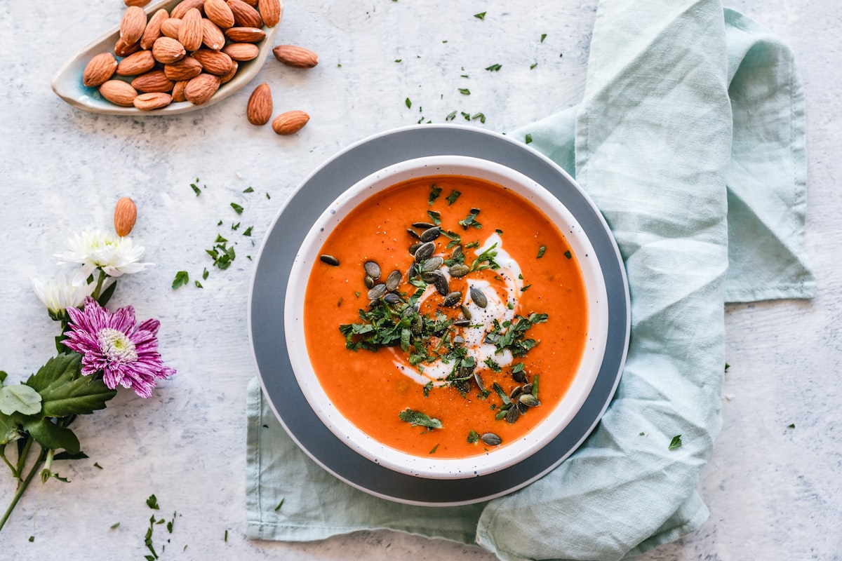 Bowl of Creamy Tuscan White Bean Soup with kale and parmesan